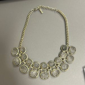 Chunky gold necklace with grey gems